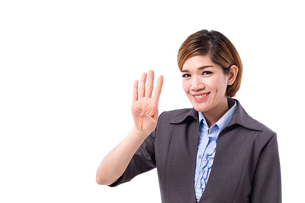 istock business woman pointing up four finger 594449246