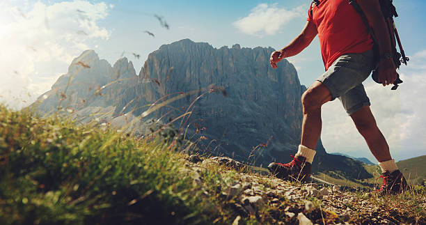 istock Senior man trail hiking on high mountain 594450256