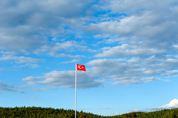 istock Flag of Turkey against blue sky 594450754