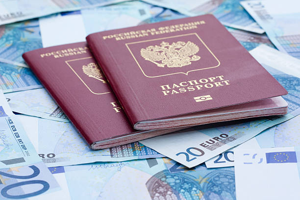 istock Some euro banknotes and russian passport 594451312