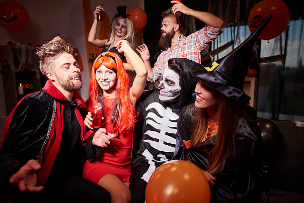istock Spooky costumes at halloween friends 594451512