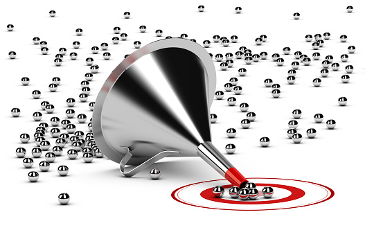 3D illustration of a sales funnel over white background with metal spheres in the center of a red target.