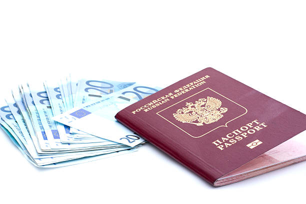 istock Some euro banknotes and russian passport 594451862