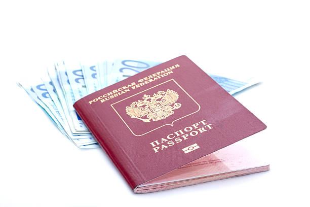 istock Some euro banknotes and russian passport 594451908