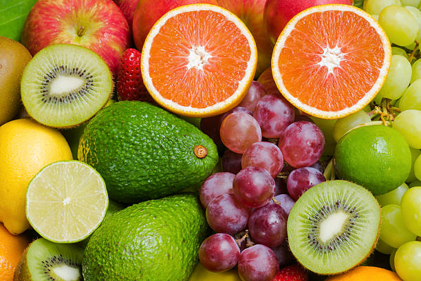istock Nutritious fresh fruits and vegetables background 594452678