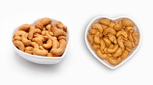 istock cashew nut  in a heart shaped bowl 594454804