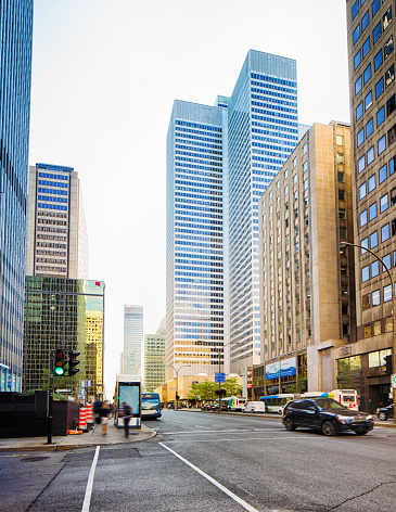 Downtown Montreal financial district on a sunny Summer afternoon featuring the Place Ville-Marie building and René-Lévesque boulevard.