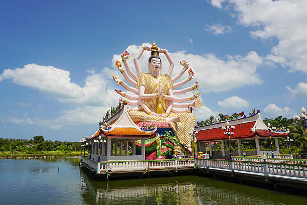 istock Buddhist Guan Yin statue at Plai Laem temple 594457790