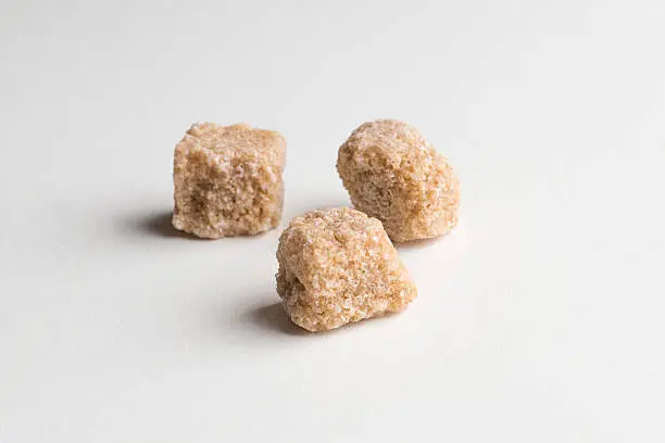 Pure Sugar Cane Cubes on a white background