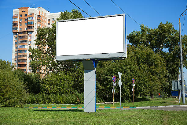 istock Blank billboard on a street near the road 594460600
