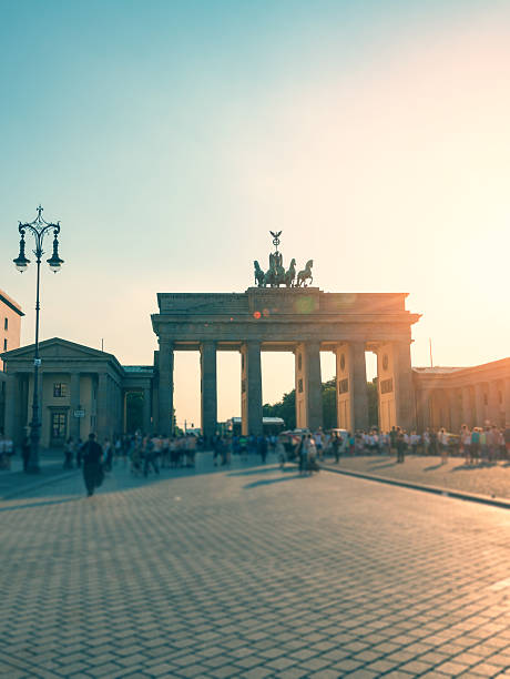 istock summer afternoon with sun backlit at Brandenburger Tor Berlin 594461622
