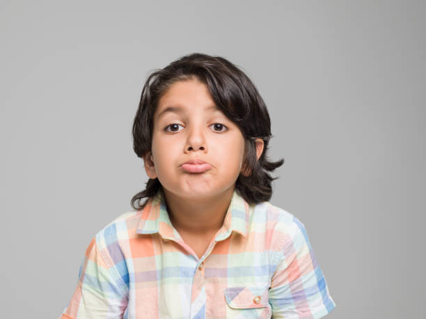 istock Little boy shrugging shoulders 594461928