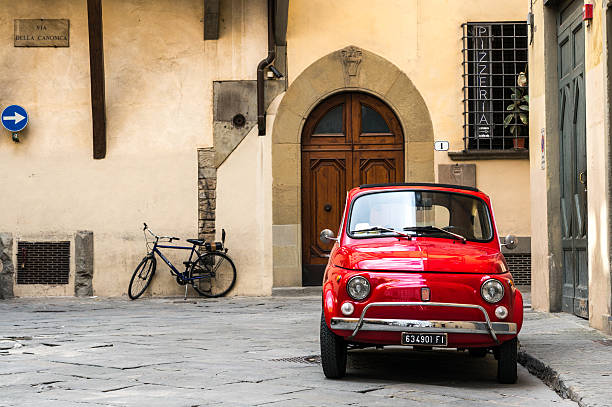 Vintage Fiat 500L parked Florence, Italy - April 25, 2016: Vintage Fiat 500L parked on quite street in the old town of Florence. little fiat car stock pictures, royalty-free photos & images