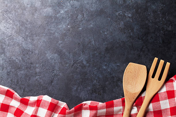 istock Kitchen table with towel and utensil 594462370