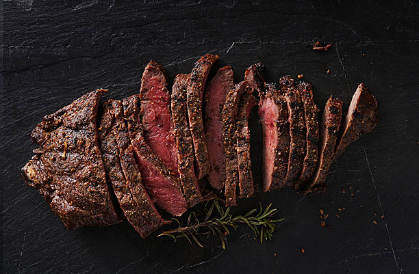 grilled flat iron steak shot in flat lay style - low key imagens e fotografias de stock