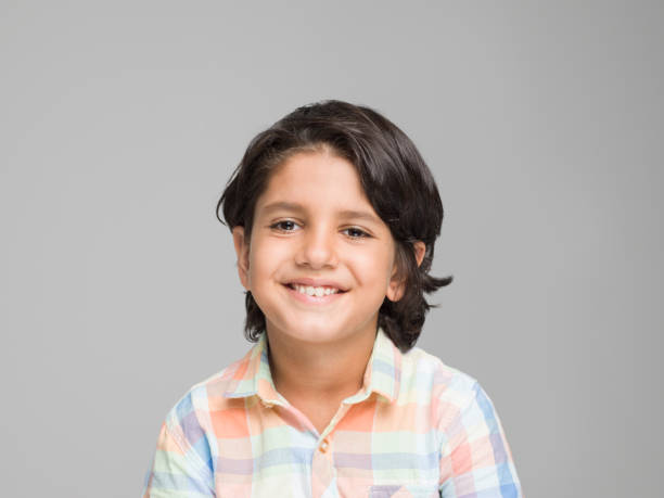 istock Portrait of happy young boy 594463400