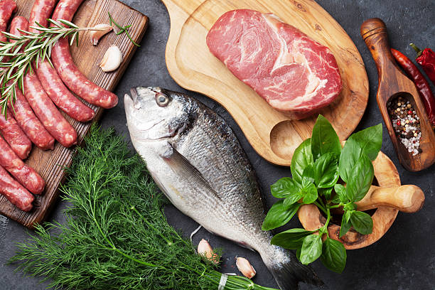 istock Sausages, fish and meat cooking 594464350