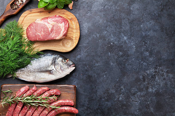 istock Sausages, fish and meat cooking 594464450