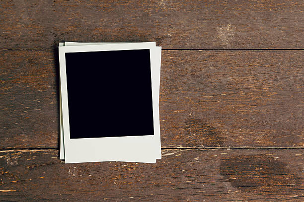 istock Three vintage frame photo blank on old wood background 594465456