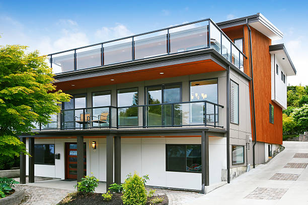 istock Modern three level house exterior with wooden trim 594466330
