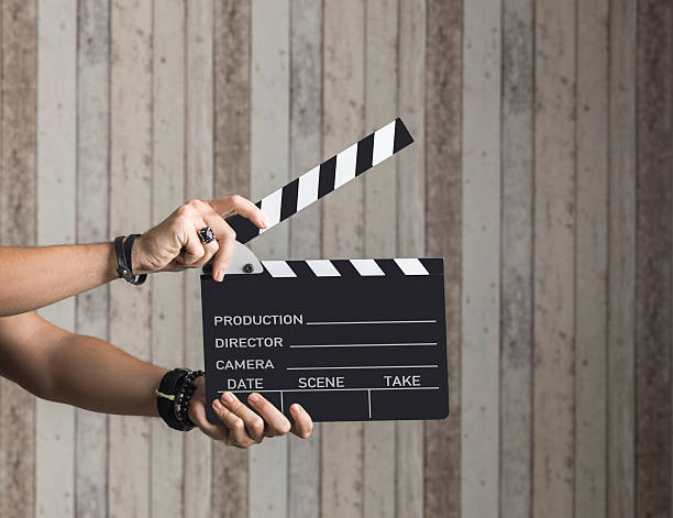 istock Man holding a movie clapboard 594466890