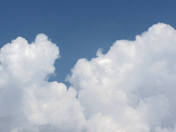 istock Sky with giants cumulonimbus clouds and sun rays through 594467886