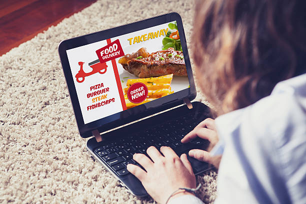 istock Takeaway food delivery service on a laptop computer. 594470186