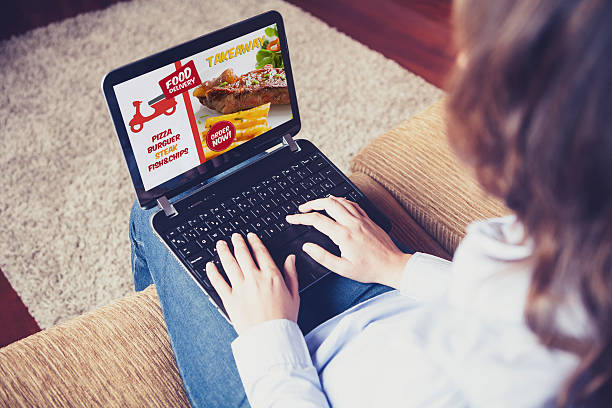 istock Takeaway food delivery website in a laptop screen. 594470256