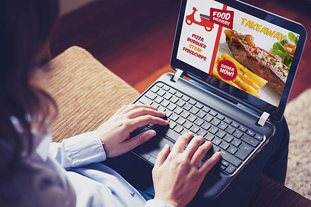 istock Takeaway food delivery website in a laptop screen. 594470422