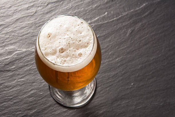 istock Glass beer on stone background with copy space. wallpaper 594472176