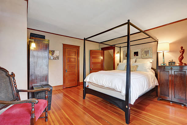 istock Interior of master bedroom with canopy bed 594472966
