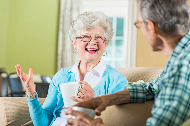 istock Senior woman has morning coffee with husband 594473428