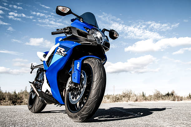 Suzuki GSX-R750 Novyy Urengoy, Russia - August 21, 2016: Blue bike Suzuki GSX-R750 is parked at the countryside. super bike stock pictures, royalty-free photos & images