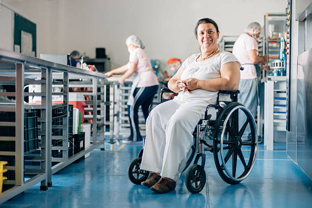 istock Disabled Woman Owner of Bakery Workshop 594475190