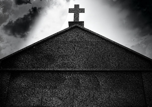 Crux on a Grave A grave shot in Bonifacio, Corsica exorcism stock pictures, royalty-free photos & images