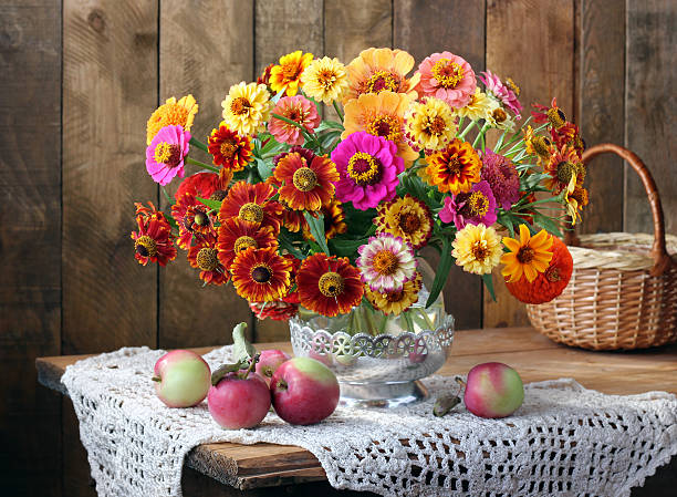 istock Still life with a bouquet and apples. 594476414