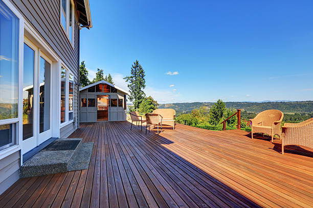 istock Large walkout deck with wicker furniture 594478416