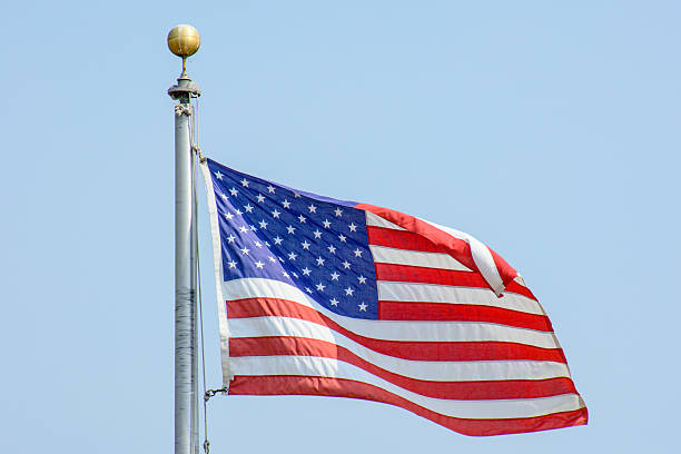 istock USA Flag Flying in the Wind 594478594