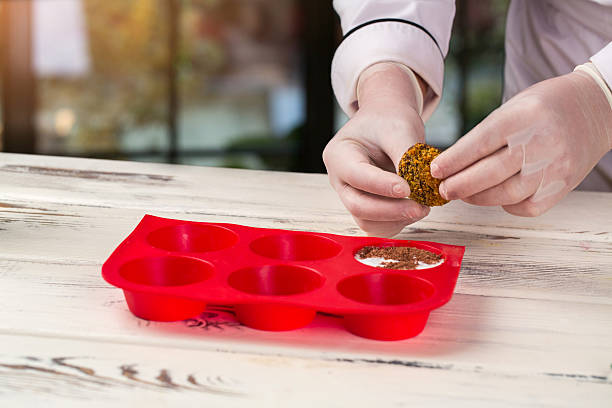istock Hands in gloves hold biscuit. 594478946