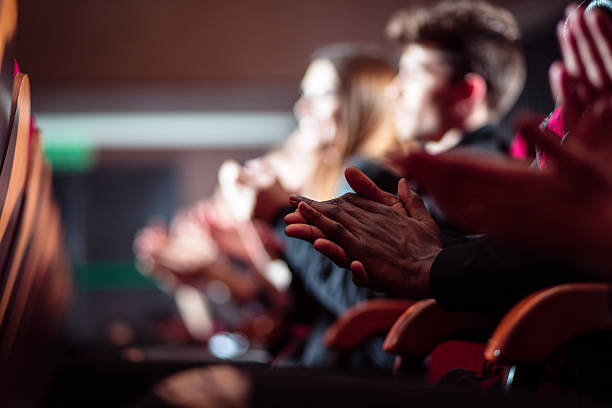 people in the theater, close up of clapping hands - theater publiek stockfoto's en -beelden