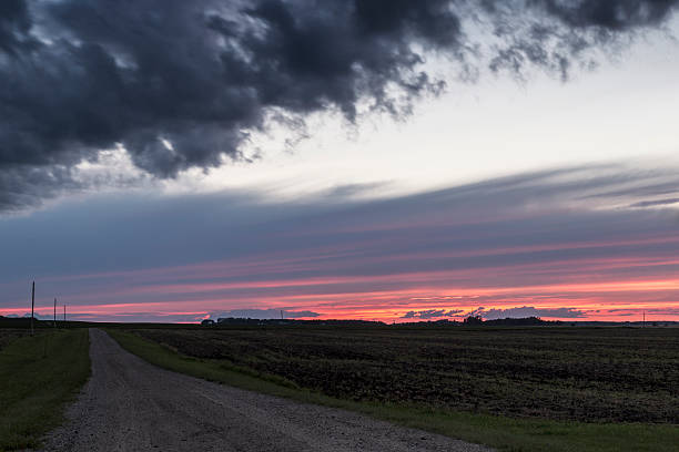 istock Rural Minnesota Country Road and Sunset 594481258