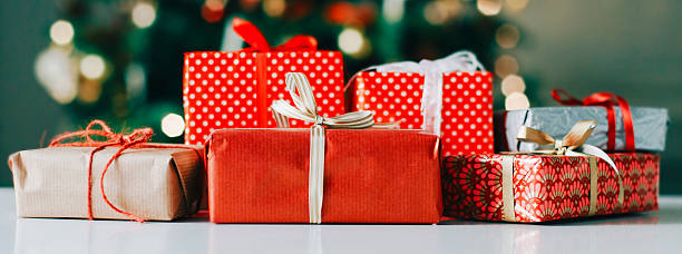 istock Wrapped christmas presents on a row 594481618