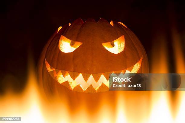 Spooky Carved Halloween Pumpkin In Hot Burning Hell Fire Flames Stock Photo - Download Image Now