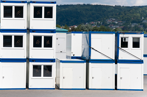 Stacked container homes and bathrooms, provided temporary shelters for refugees in Germany.