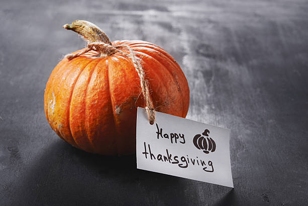 istock pumpkin and thanksgiving card 594482336