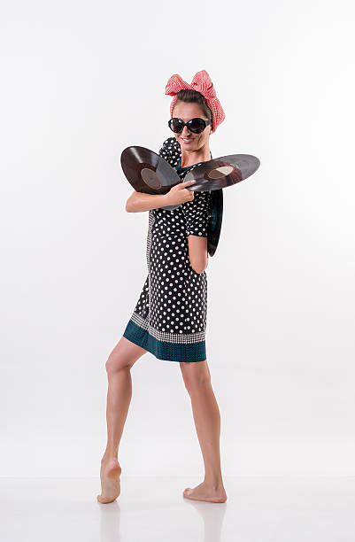 istock Retro stylish woman with gramophone record 594482652