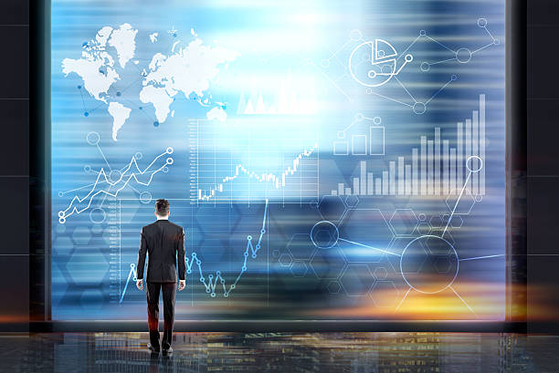 istock Man looking at business charts 594483628