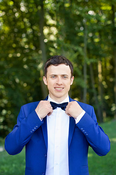 portrait of the groom in a stylish dress on the - jacket shirt male fashion imagens e fotografias de stock