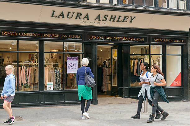 People walk by Laura Ashley store stock photo
