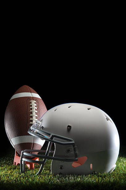 istock College Football and Helmet 594486544